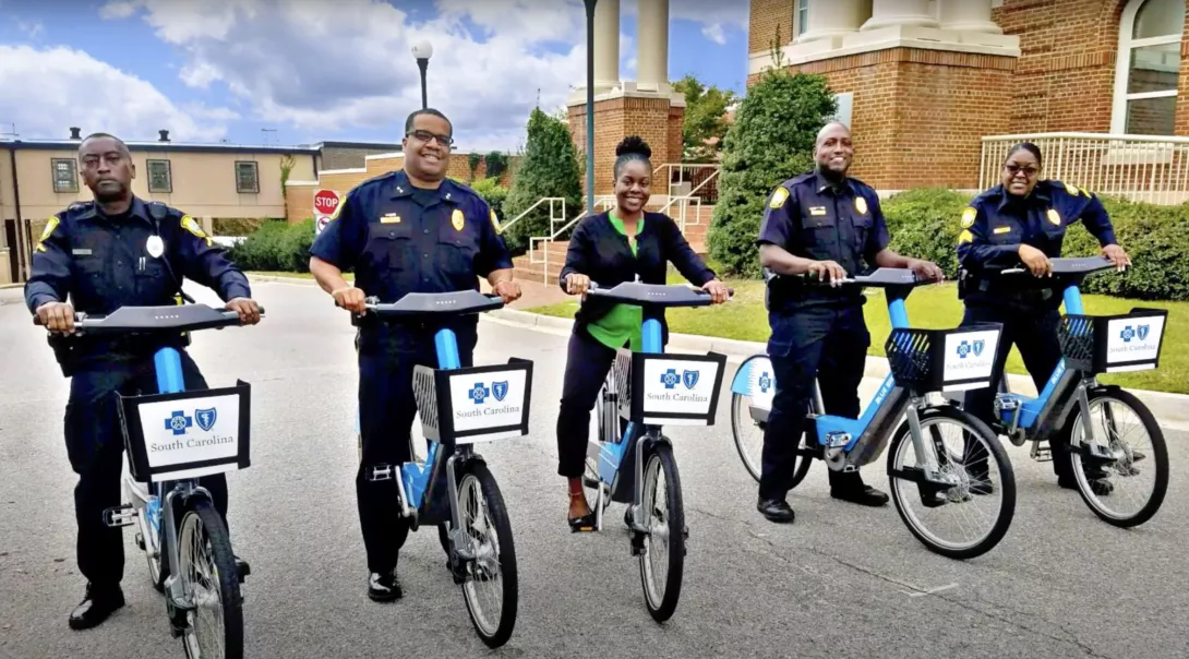 Public safety officers on Blue Bikes.